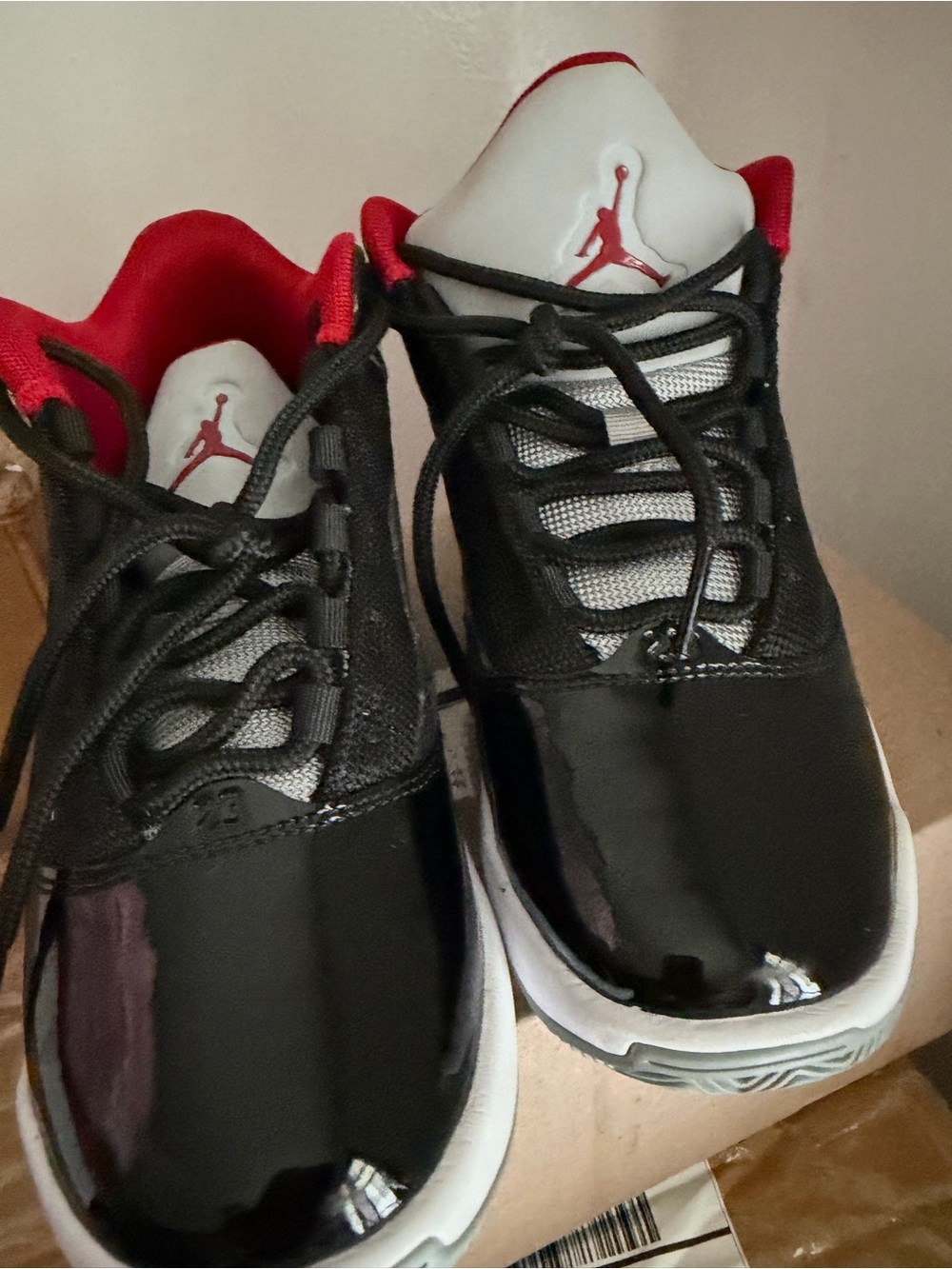 Kids Black and Red Low-Top Jumpman Sneakers